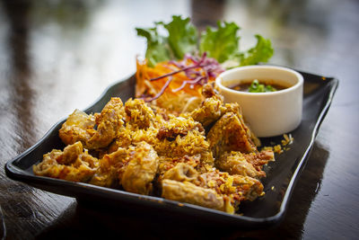 Close-up of food served on table