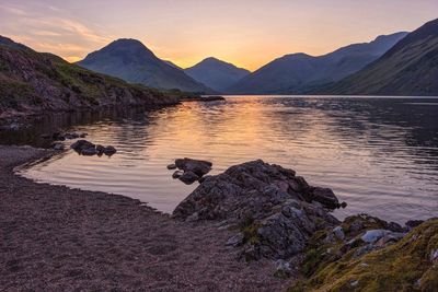 Scenic view of lake against sky during sunset