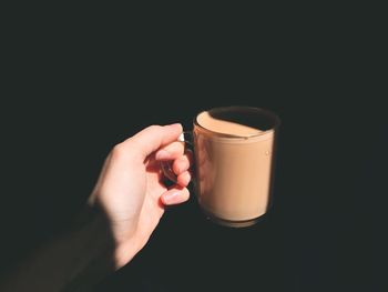 Close-up of hand holding drink