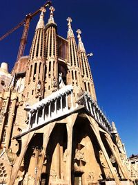 Low angle view of church against blue sky