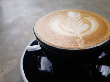 High angle view of cappuccino on table