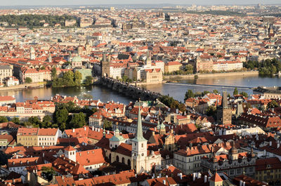 High angle view of cityscape and river against sky