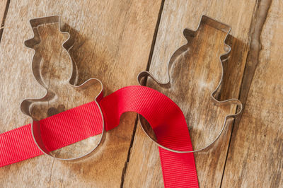 High angle view of pastry cutters on wooden table