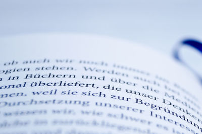 Close-up of book with blue bookmark