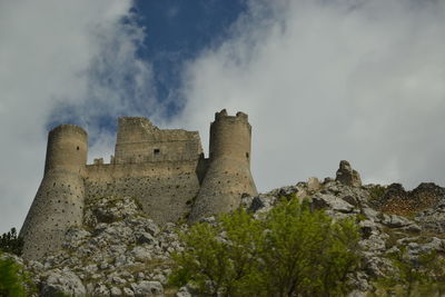 Low angle view of rock formation against sky
