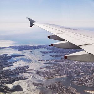 View of airplane wing over sea
