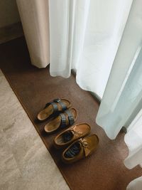 High angle view of shoes on bed at home