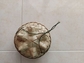 Close-up of ball on table against wall