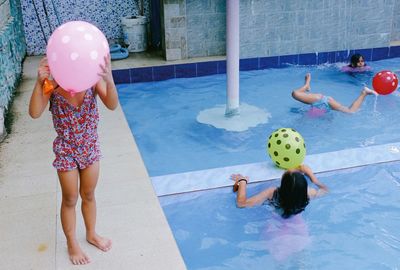 Girl playing in swimming pool