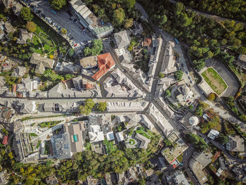 High angle view of trees and buildings in city