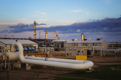 View of power station against cloudy sky