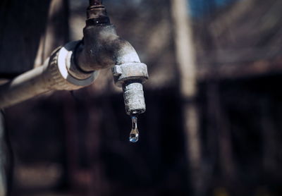 Close-up of water falling from faucet