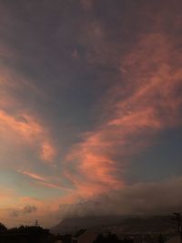 Scenic view of landscape against cloudy sky