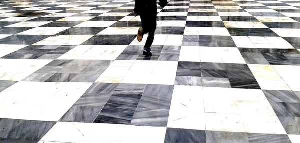 People walking on tiled floor