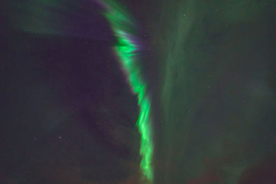 Low angle view of illuminated sky at night