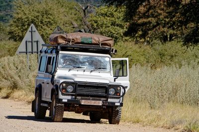 View of outdoor safari car on rough dirt road