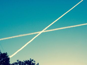 Low angle view of vapor trail against sky