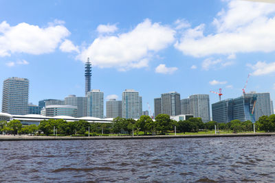 Modern buildings in city against sky