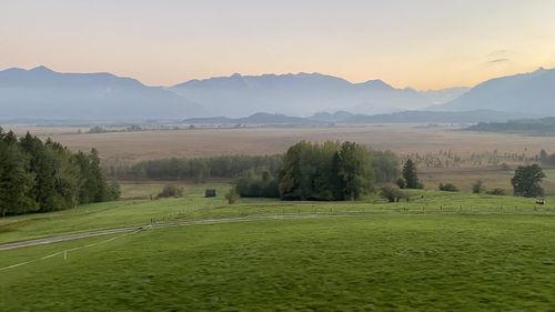 Scenic view of landscape and mountains against sky
