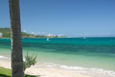 Scenic view of sea against blue sky