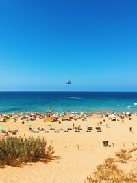 Scenic view of sea against clear blue sky