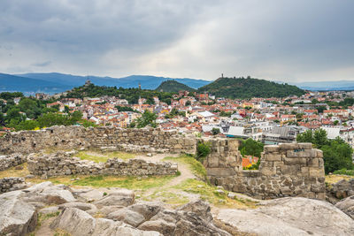 View of buildings against cloudy sky