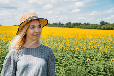 Ukrainian girl young woman on the background of sunflowers field. ukraine sunflowers national