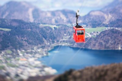 Close-up of red car on mountain against sky