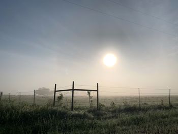 Scenic view of field against sky during sunset