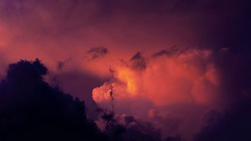 Low angle view of dramatic sky at night