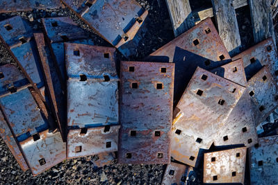 Directly above view of rusty metallic hinges