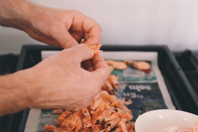 Close-up of man preparing food