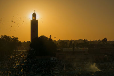 Silhouette koutoubia mosque against sky during sunset