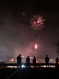 Firework display at night