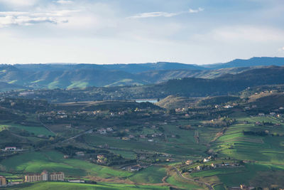 Aerial view of landscape and townscape against sky