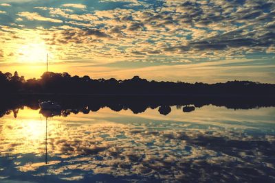 Scenic view of lake during sunset