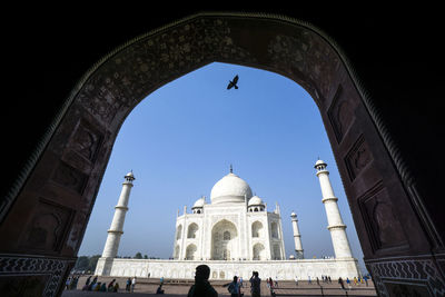 Low angle view of taj mahal against clear blue sky