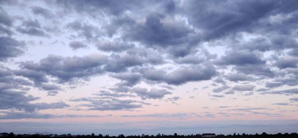 Low angle view of dramatic sky during sunset