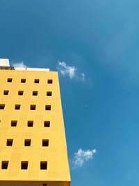 Low angle view of building against blue sky