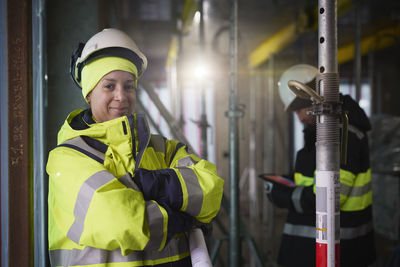 Portrait of smiling female engineer at construction site