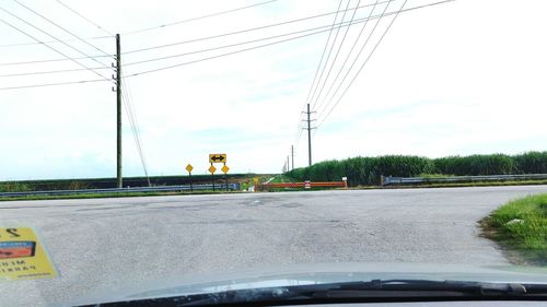 Airplane flying over road