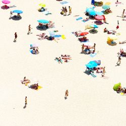 Crowd playing on beach