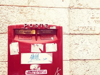 Close-up of text on brick wall