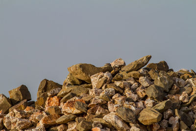 Stack of rocks against clear sky