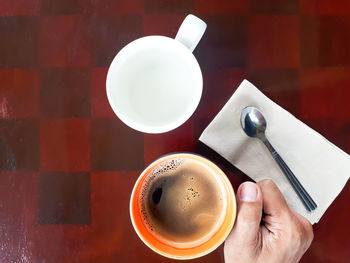 Directly above shot of coffee cup on table