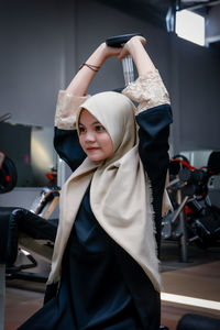 Rear view of woman standing in gym