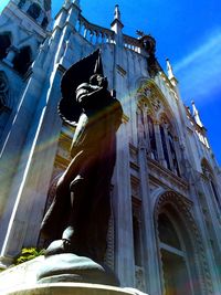 Low angle view of built structure against blue sky