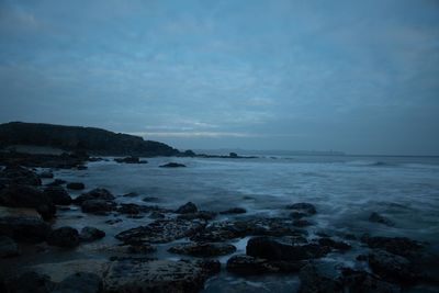 Scenic view of sea against sky at dusk