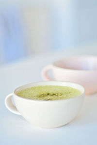 Close-up of coffee cup on table