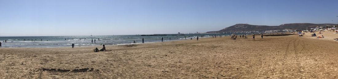 Scenic view of beach against clear sky